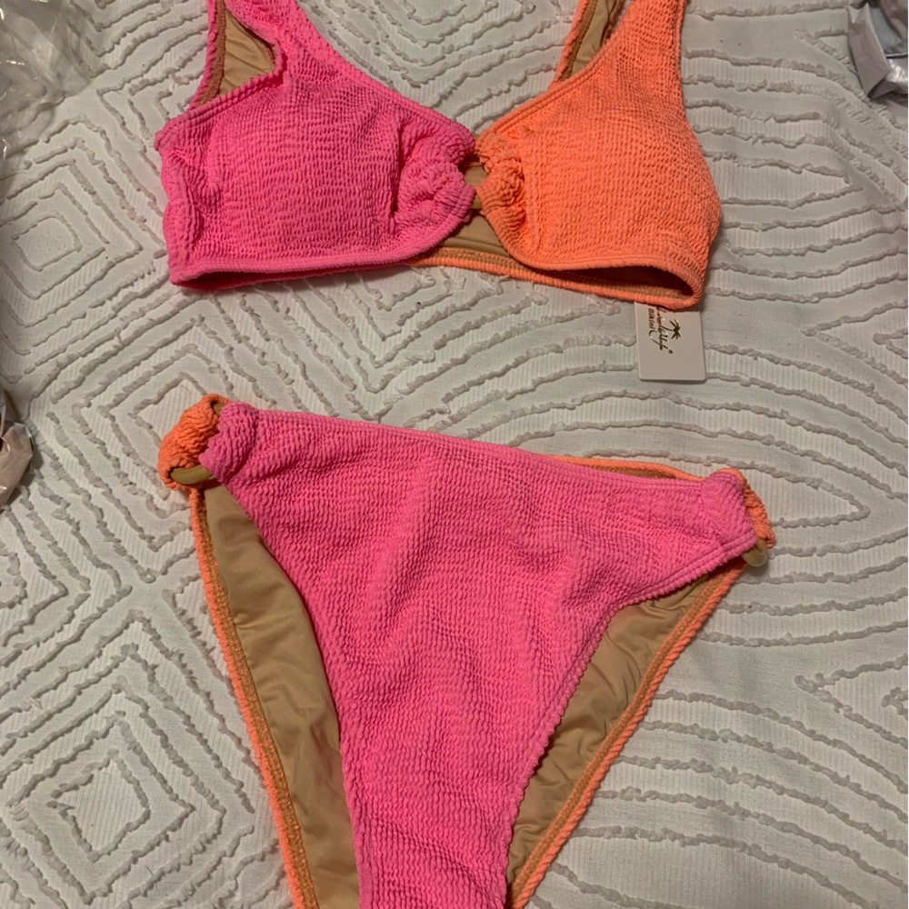 Orange & Pink color block. Brand new Swim Suit w/ tags!